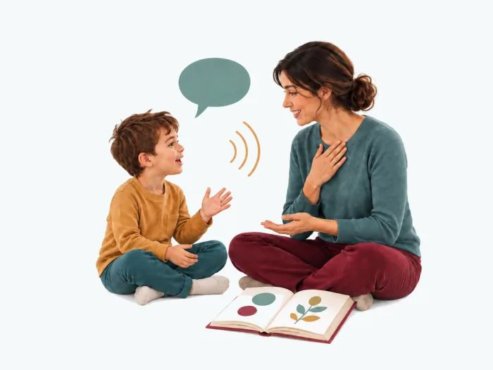 Niño y logopeda realizando juntos una actividad de comunicación